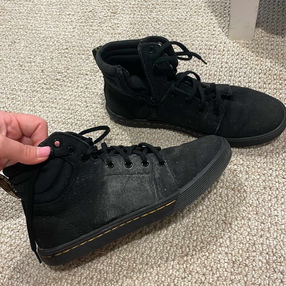 Black Doc Martin hightops with soft soles.